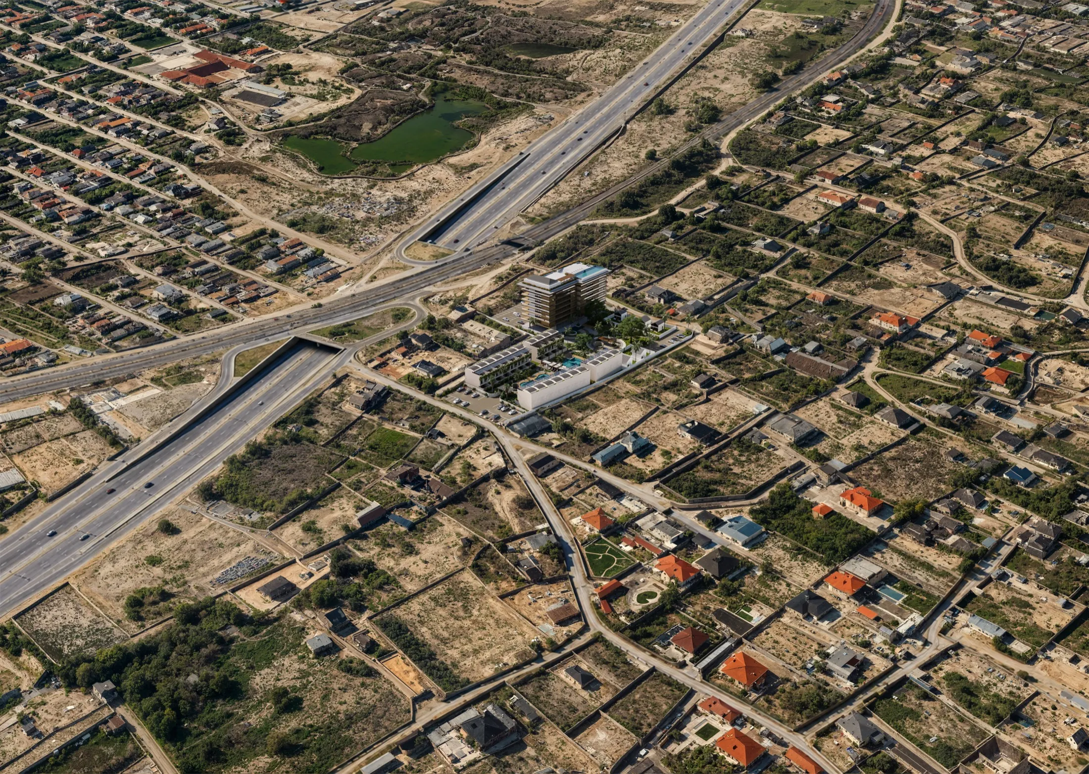 High aerial showing the site in its neighbourhood