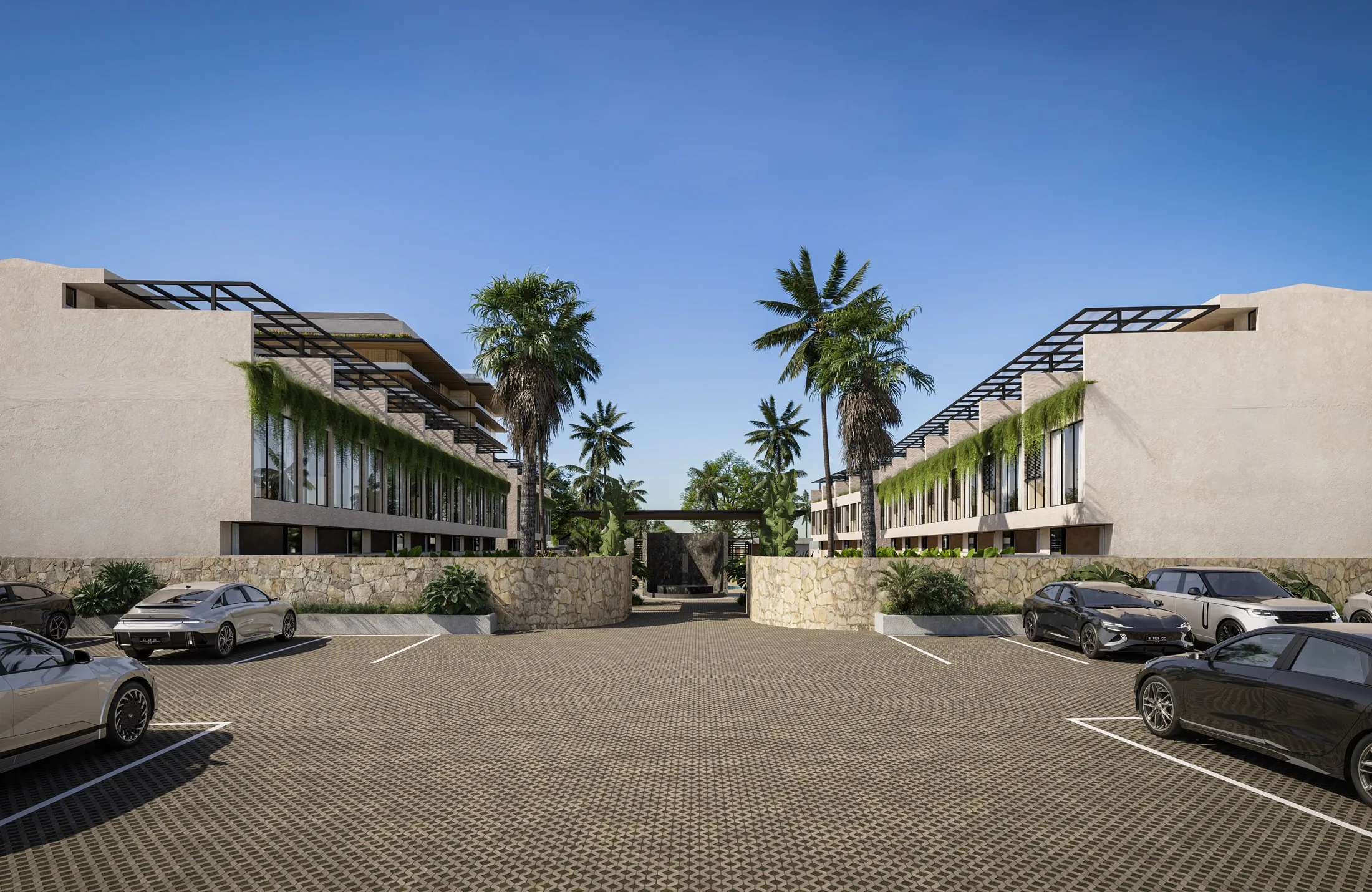 Arrival court with stone walls and the garden homes either side
