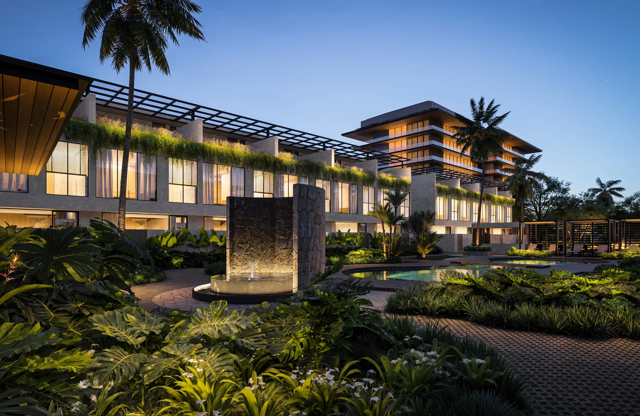The same water wall lit at night, terraces glowing